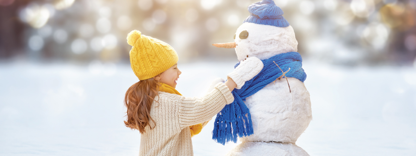 Girl Building a Snowman
